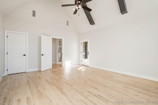 empty room featuring ceiling fan, high vaulted ceiling, and light hardwood / wood-style flooring