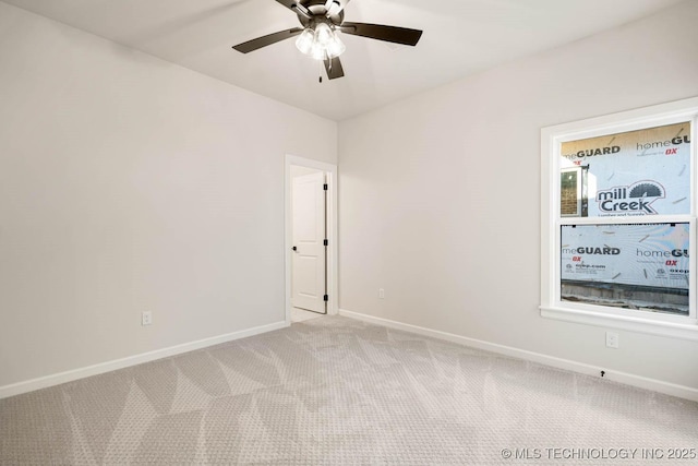 carpeted empty room with ceiling fan