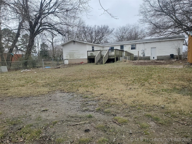 back of property featuring a deck