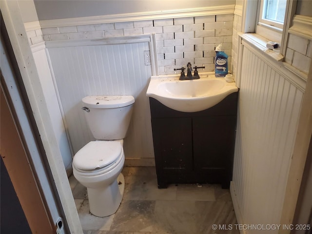 bathroom featuring vanity and toilet