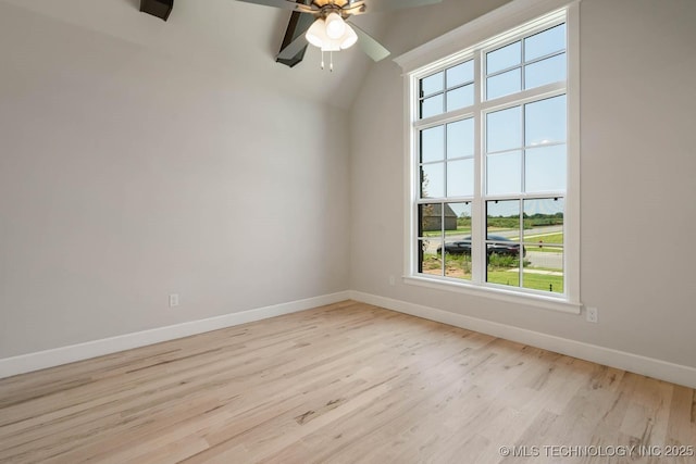 unfurnished room with light hardwood / wood-style floors, plenty of natural light, lofted ceiling, and ceiling fan