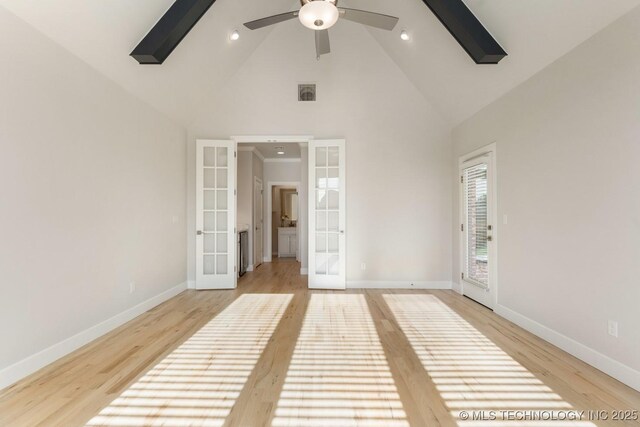 unfurnished bedroom with high vaulted ceiling, baseboards, french doors, and visible vents