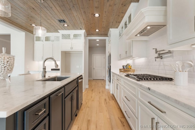 kitchen with custom exhaust hood, recessed lighting, wood ceiling, a sink, and stainless steel appliances