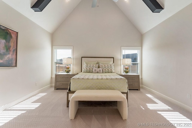 bedroom featuring light colored carpet, baseboards, ceiling fan, and high vaulted ceiling