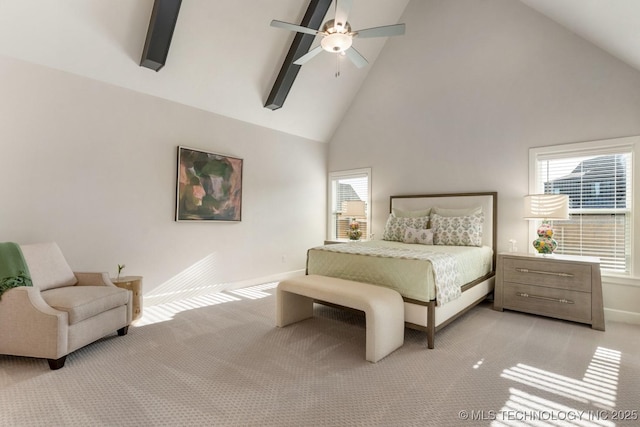 bedroom featuring multiple windows, light carpet, and high vaulted ceiling