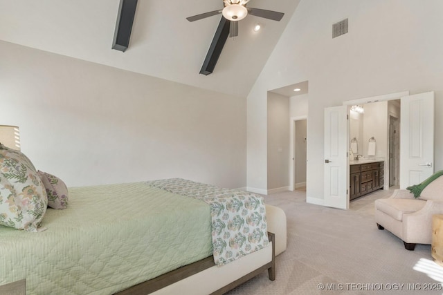 bedroom featuring visible vents, light carpet, baseboards, high vaulted ceiling, and connected bathroom