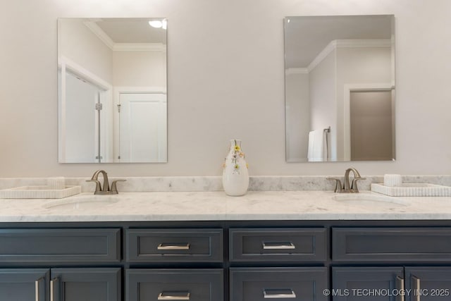 bathroom with crown molding, double vanity, and a sink