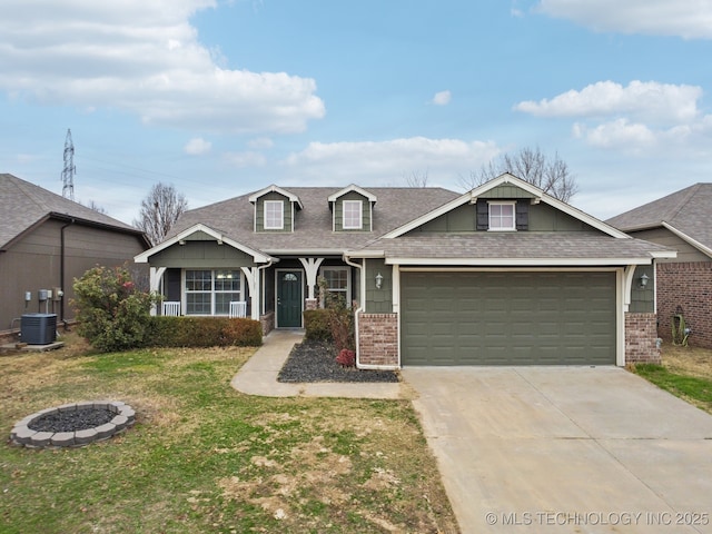 view of front of home with central AC unit, a garage, and a front lawn