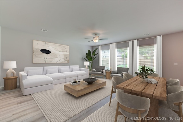 living room featuring ceiling fan and light wood-type flooring