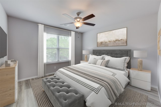 bedroom featuring ceiling fan and light hardwood / wood-style flooring