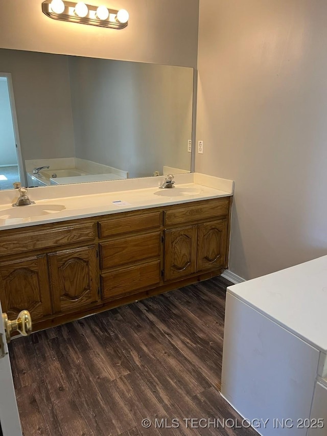 bathroom featuring wood-type flooring and vanity