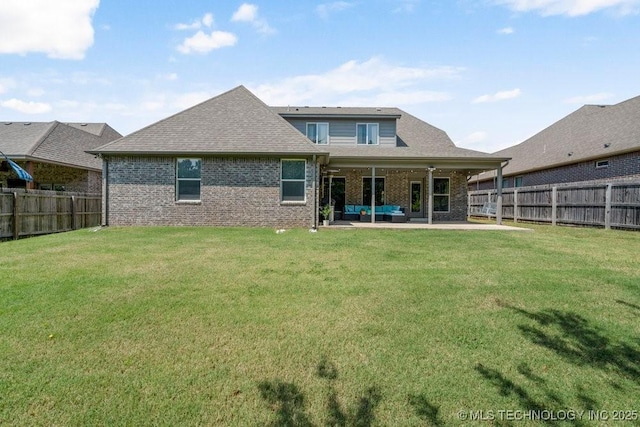 rear view of property featuring a lawn, outdoor lounge area, ceiling fan, and a patio