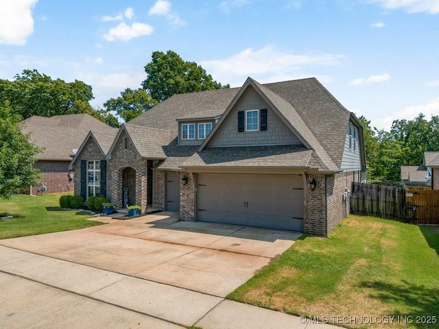 view of front facade with a garage and a front yard