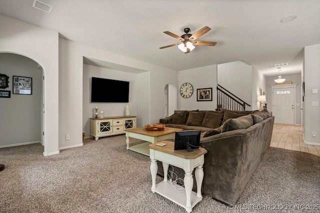 carpeted living room featuring ceiling fan