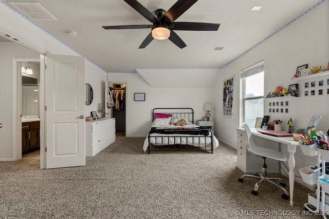 bedroom featuring ceiling fan, a spacious closet, carpet floors, and a closet