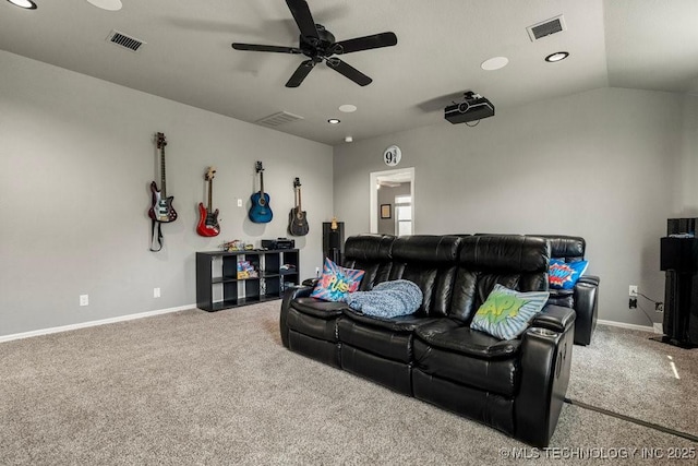 home theater room with ceiling fan, carpet floors, and vaulted ceiling