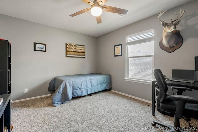 bedroom with ceiling fan and light carpet