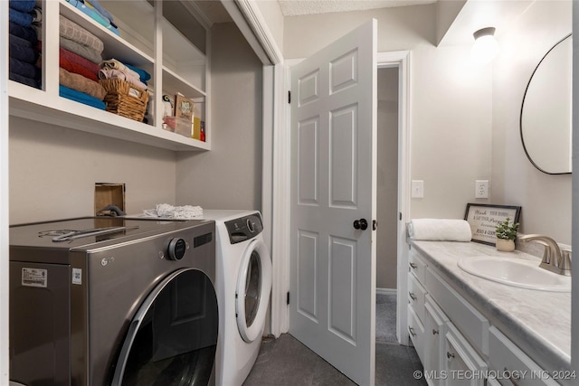 laundry area with washer and dryer and sink