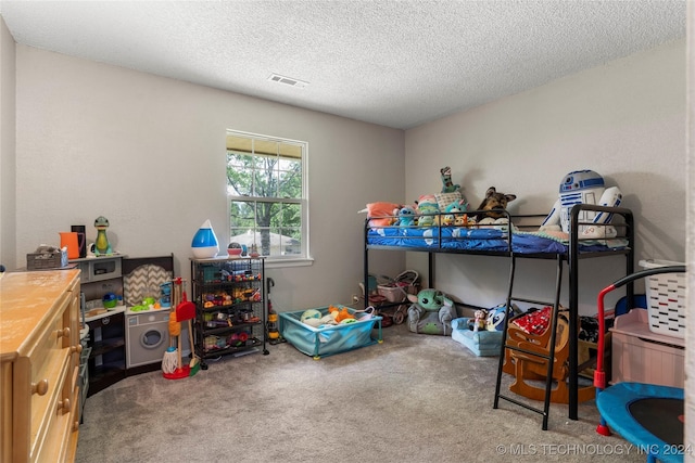 interior space featuring carpet flooring and a textured ceiling