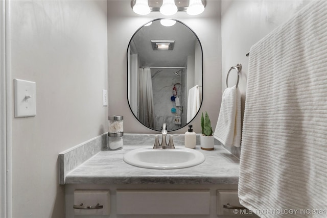 bathroom with a shower with curtain and vanity