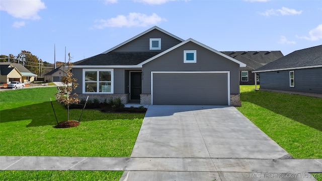 view of front of house with a front yard and a garage