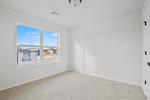 empty room featuring light colored carpet