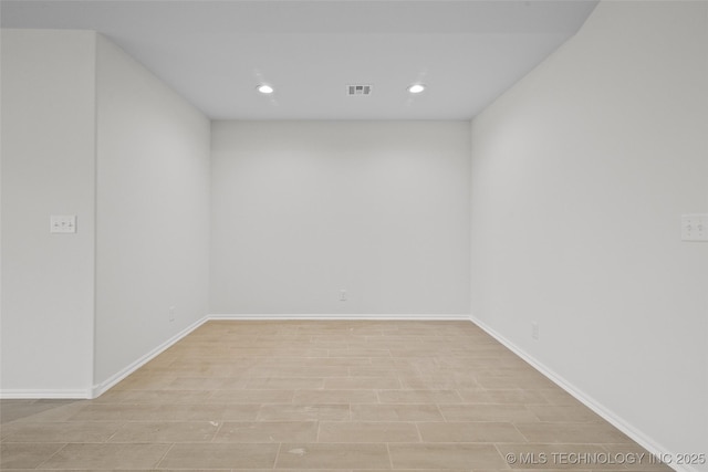 spare room with light wood-type flooring