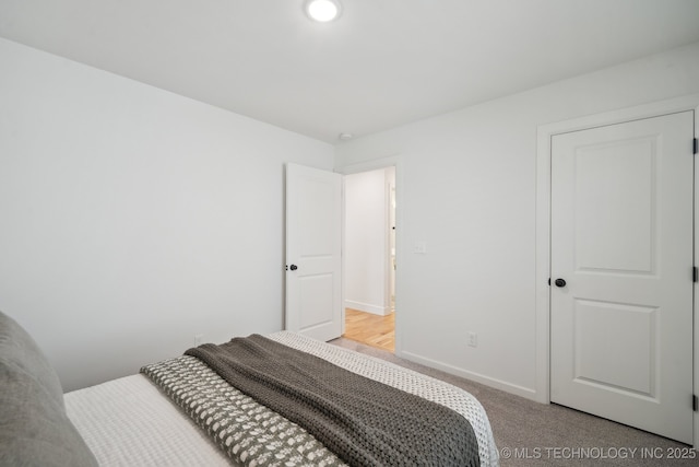 bedroom with light colored carpet