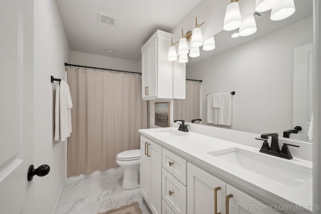 bathroom with vanity and toilet