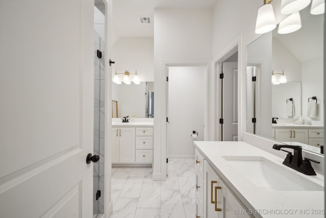 bathroom with vanity and lofted ceiling