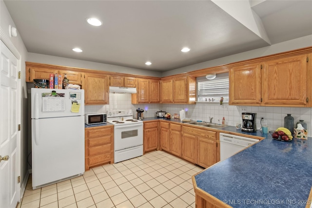 kitchen with decorative backsplash, white appliances, light tile patterned flooring, and sink