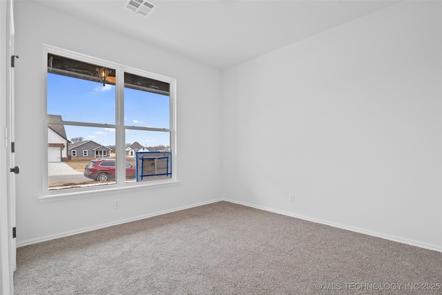 unfurnished room with carpet flooring