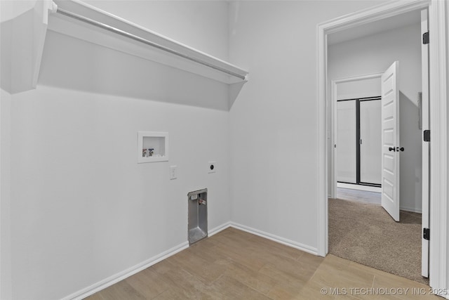 laundry room with hookup for a washing machine, electric dryer hookup, and light hardwood / wood-style flooring