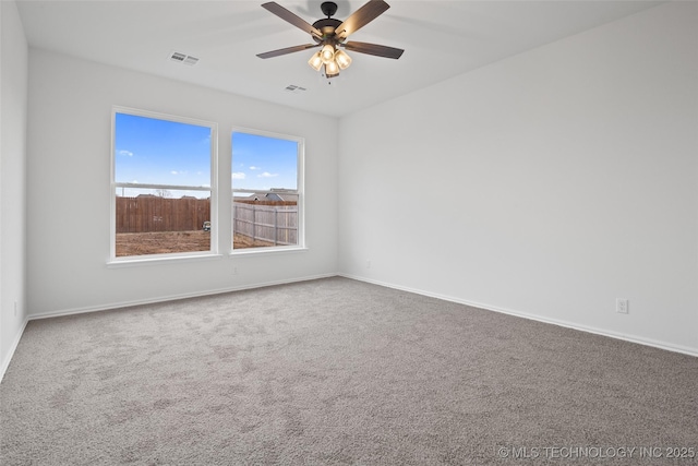 carpeted empty room with ceiling fan