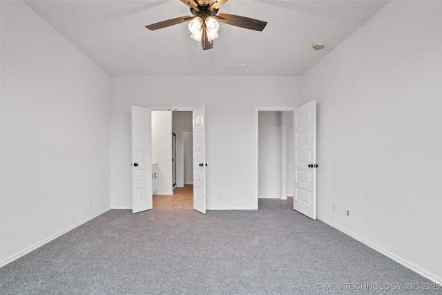 unfurnished bedroom featuring ceiling fan and carpet floors