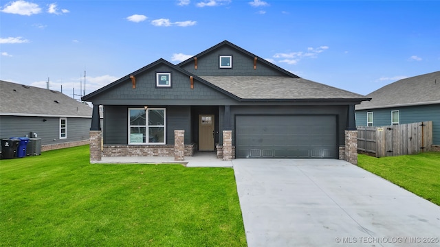 view of front of property featuring a garage and a front lawn