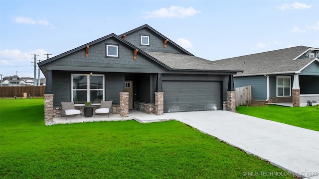 craftsman house with a garage, a front lawn, and covered porch