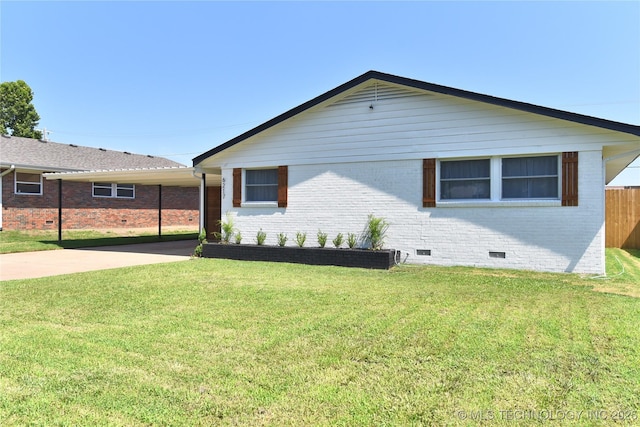 view of side of property featuring a yard