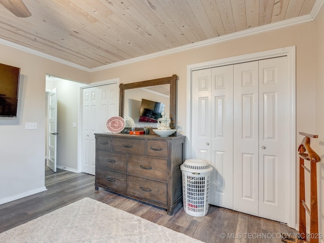 bedroom featuring wooden ceiling, dark hardwood / wood-style floors, ceiling fan, and ornamental molding