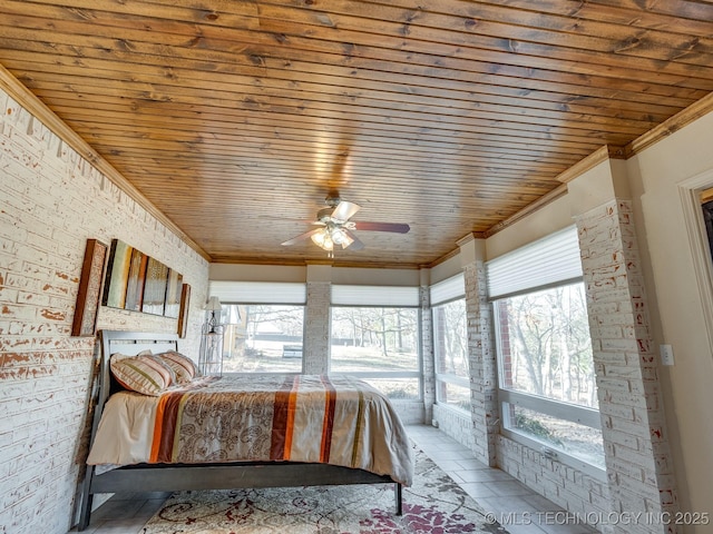 unfurnished bedroom featuring brick wall, ceiling fan, crown molding, wooden ceiling, and light tile patterned flooring