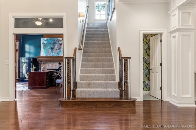 stairs with wood-type flooring