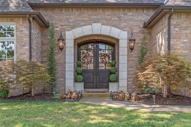 view of exterior entry featuring french doors