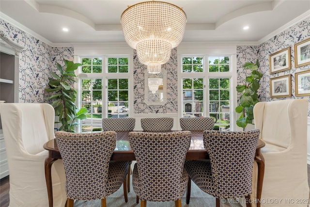 dining space featuring crown molding and an inviting chandelier