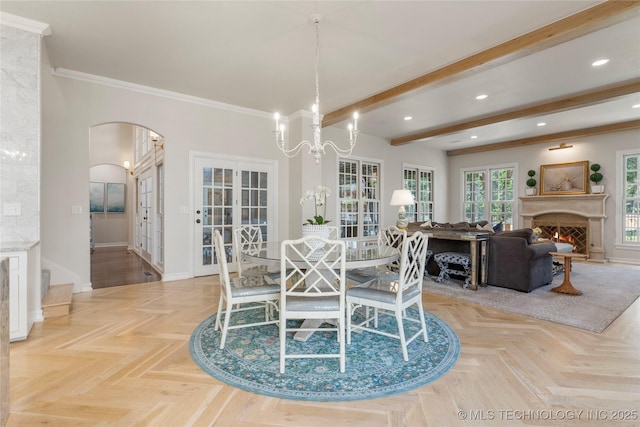 dining room with an inviting chandelier, french doors, light parquet floors, ornamental molding, and beamed ceiling