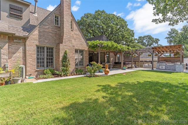 view of yard featuring a patio, a pergola, and area for grilling