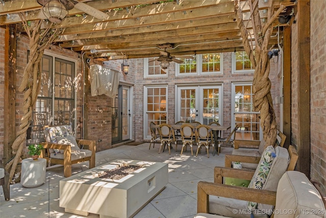 view of patio / terrace featuring a pergola, ceiling fan, and french doors