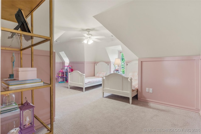 carpeted bedroom featuring ceiling fan and lofted ceiling