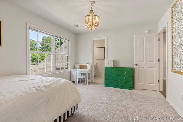 bedroom with light carpet and a chandelier