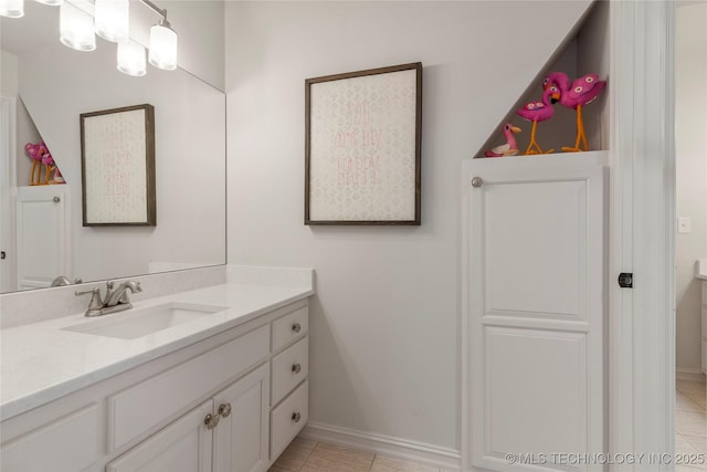 bathroom featuring tile patterned flooring and vanity