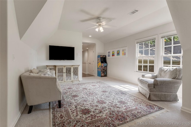 carpeted living room featuring vaulted ceiling and ceiling fan